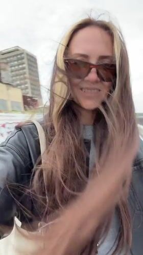 Woman walks in windy weather as choppy waters observed in Saratov
