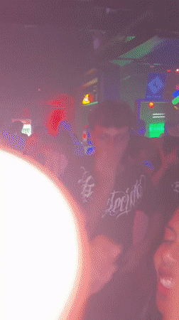 Late-night crowd dances at São Paulo nightclub under colorful lights
