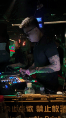 DJ performs for dancing crowd at Liangjiang nightclub