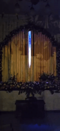 Evening worship ceremony documented at ISKCON temple in Denpasar