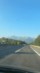 Highway drive through Colledara with Apennine mountains ahead
