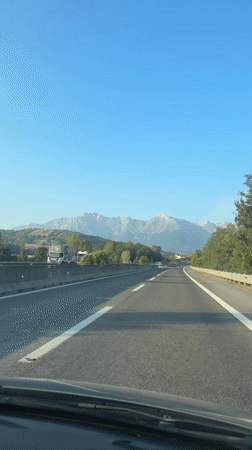 Highway drive through Colledara with Apennine mountains ahead