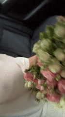 Riding through Yerevan with a bouquet of roses