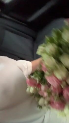 Riding through Yerevan with a bouquet of roses