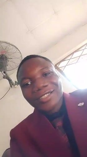 Indoor gathering documented in Madalla, Nigeria with selfies and seating