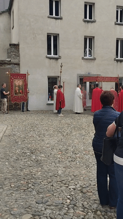 Religious procession draws observers in Biasca cobblestone square