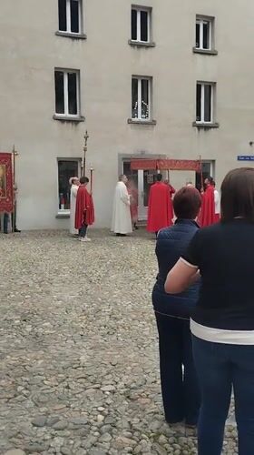 Religious procession draws observers in Biasca cobblestone square