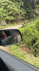 Tourist photographs journey on rural Vietnam road
