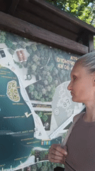 Tourist explores Zheleznovodsk park attractions and lakefront during morning visit
