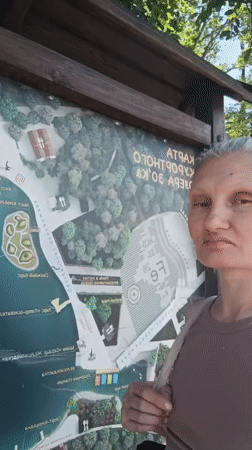 Tourist explores Zheleznovodsk park attractions and lakefront during morning visit