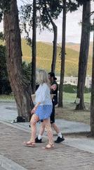 Evening street life captured in Budva featuring performers and pedestrians
