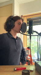 Young man records vocals in Buenos Aires studio