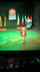 Traditional dance performance captured in La Paz auditorium
