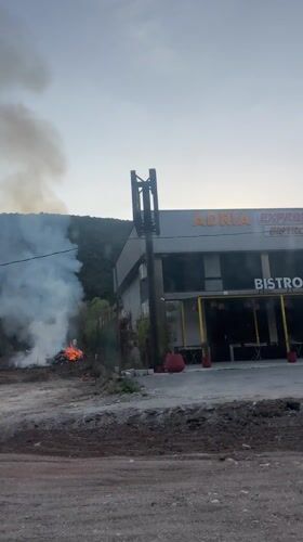 Fire burns behind Adria Express cafe in Tresnjica, Montenegro