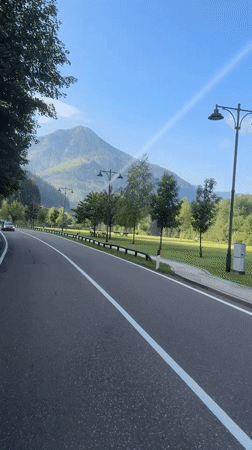 Summer morning traffic on a Dolomites road in Fassa Valley