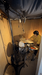 Drummer records in makeshift booth in Runnymede