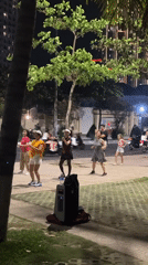 Evening exercise groups and beachgoers active in Nha Trang
