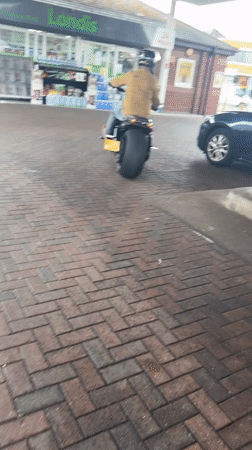 Wide-tire motorcycle at a Great Yarmouth gas station