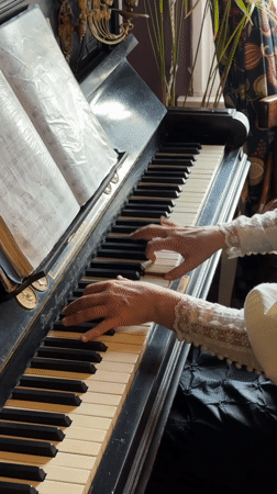Woman plays vintage piano in historical Kolomna setting