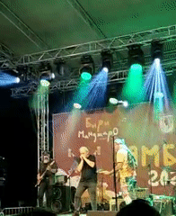 Live outdoor concert with colorful stage lighting in Yambol