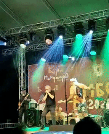 Live outdoor concert with colorful stage lighting in Yambol