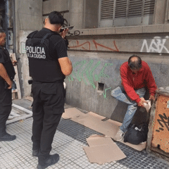 Buenos Aires police officers interact with individuals on street