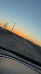 Dashcam captures sunset drive on rural road in Russia
