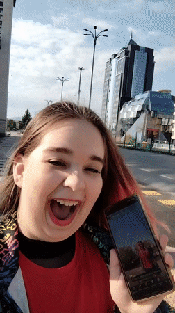 Woman takes selfie video on Plovdiv street