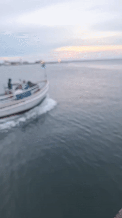 Evening boat activity around Nantucket pier waters