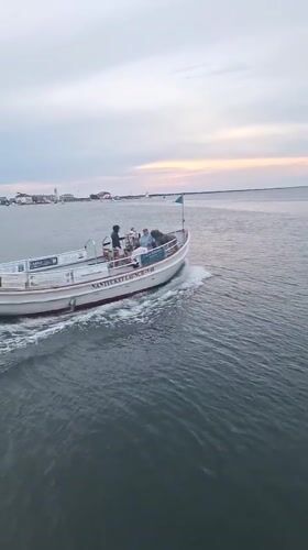 Evening boat activity around Nantucket pier waters