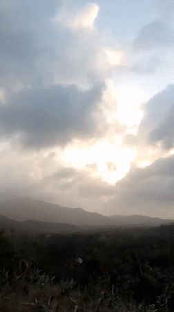 Motorcyclist documents dramatic evening skies in Tacarigua, Venezuela