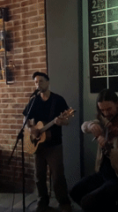 Acoustic guitarist performs live music at Montenegro bar