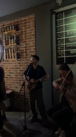 Acoustic guitarist performs live music at Montenegro bar