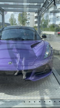 Purple Lotus Emira displayed in Cologne showroom, priced 116,750 EUR