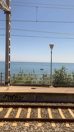 Sunny day recorded at seaside train station in Sitges
