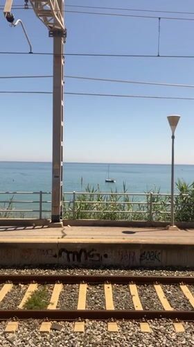 Sunny day recorded at seaside train station in Sitges