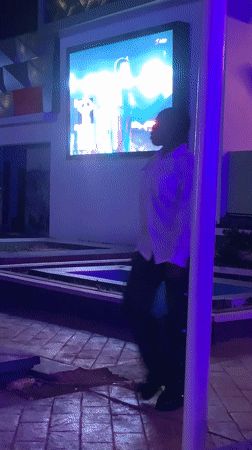 Evening gathering at illuminated rooftop venue in Gura Top