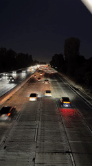 LA highway at night, light trails and steady traffic flow