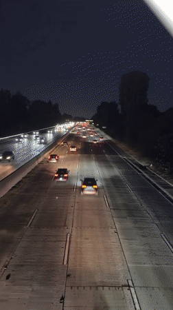 LA highway at night, light trails and steady traffic flow