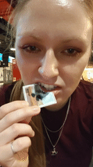 Woman drinks juice with dog photo at Samara bowling alley