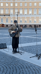 Street musicians perform at sunset in Palace Square, Saint Petersburg