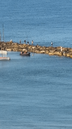 Early morning fishing and water activities in Netanya