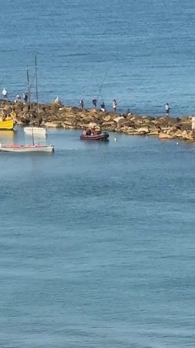 Early morning fishing and water activities in Netanya