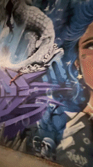 Street mural featuring woman and sea creatures documented Buenos Aires
