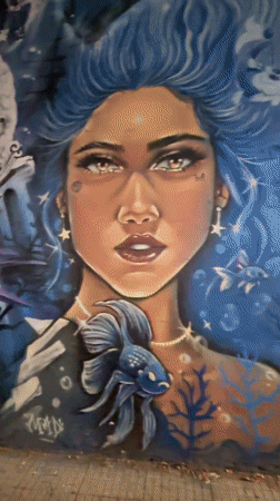 Street mural featuring woman and sea creatures documented Buenos Aires