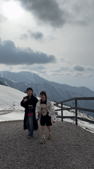 Two women walk mountain platform in Almaty, Kazakhstan