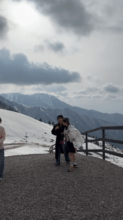 Two women walk mountain platform in Almaty, Kazakhstan