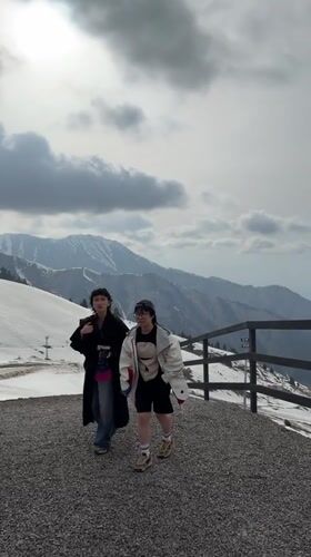 Two women walk mountain platform in Almaty, Kazakhstan