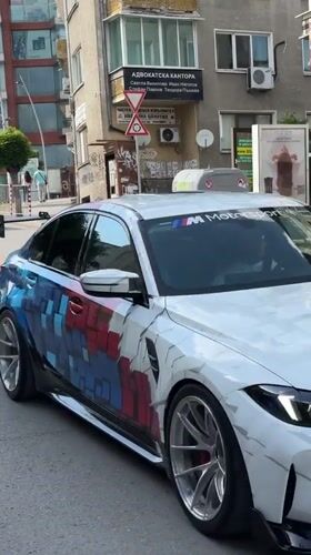 Custom BMW with geometric paint drives through Veliko Tarnovo