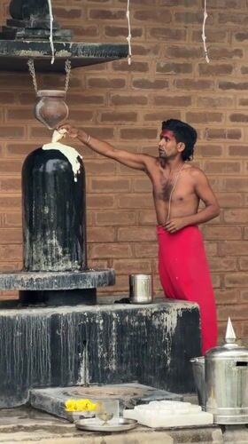 Hindu devotee performs traditional temple rituals near Bangalore